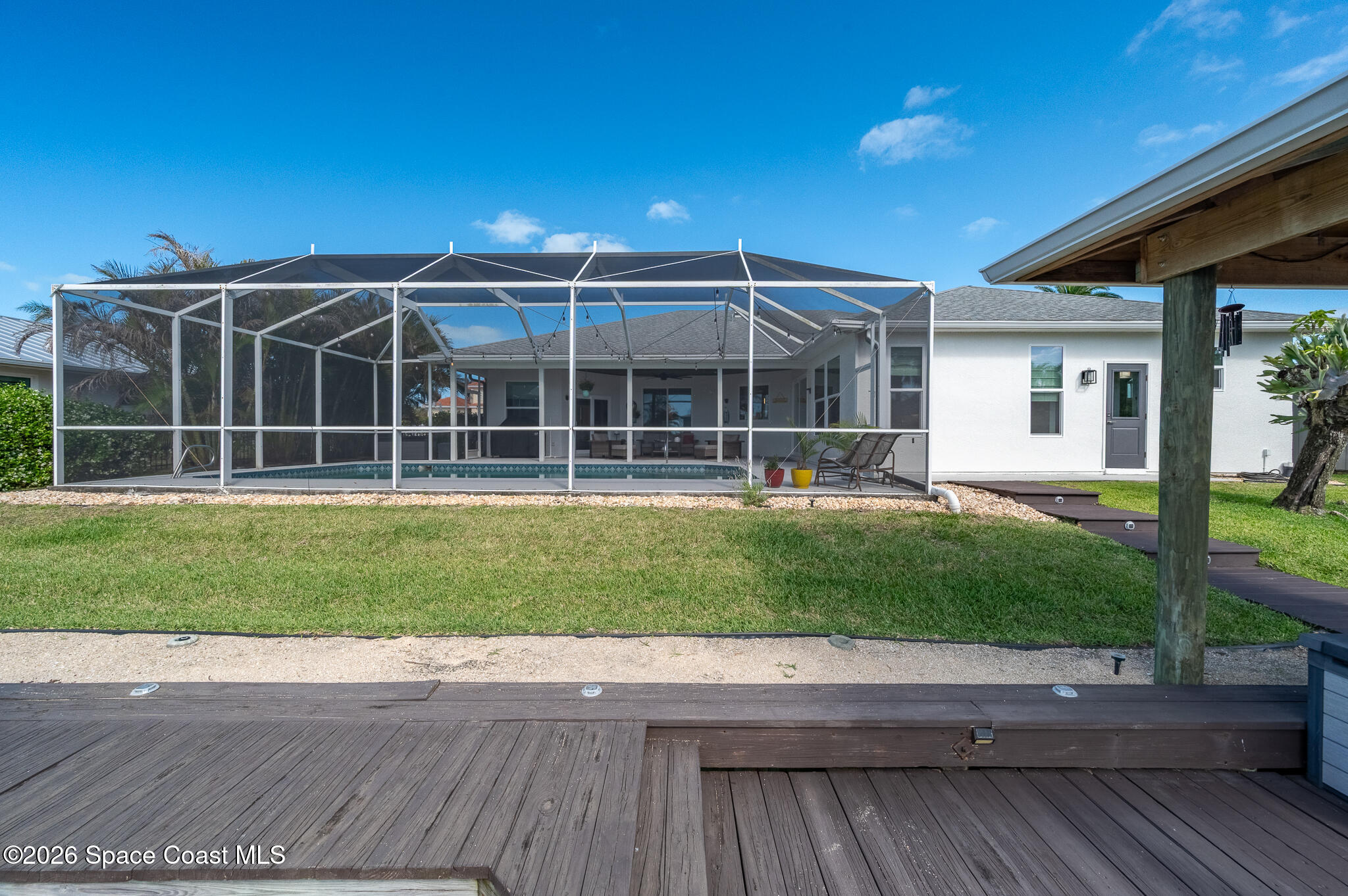 447 Sandy Key Melbourne Beach, FL 32951 - Photo 66 of 94 a view of a house next to a yard