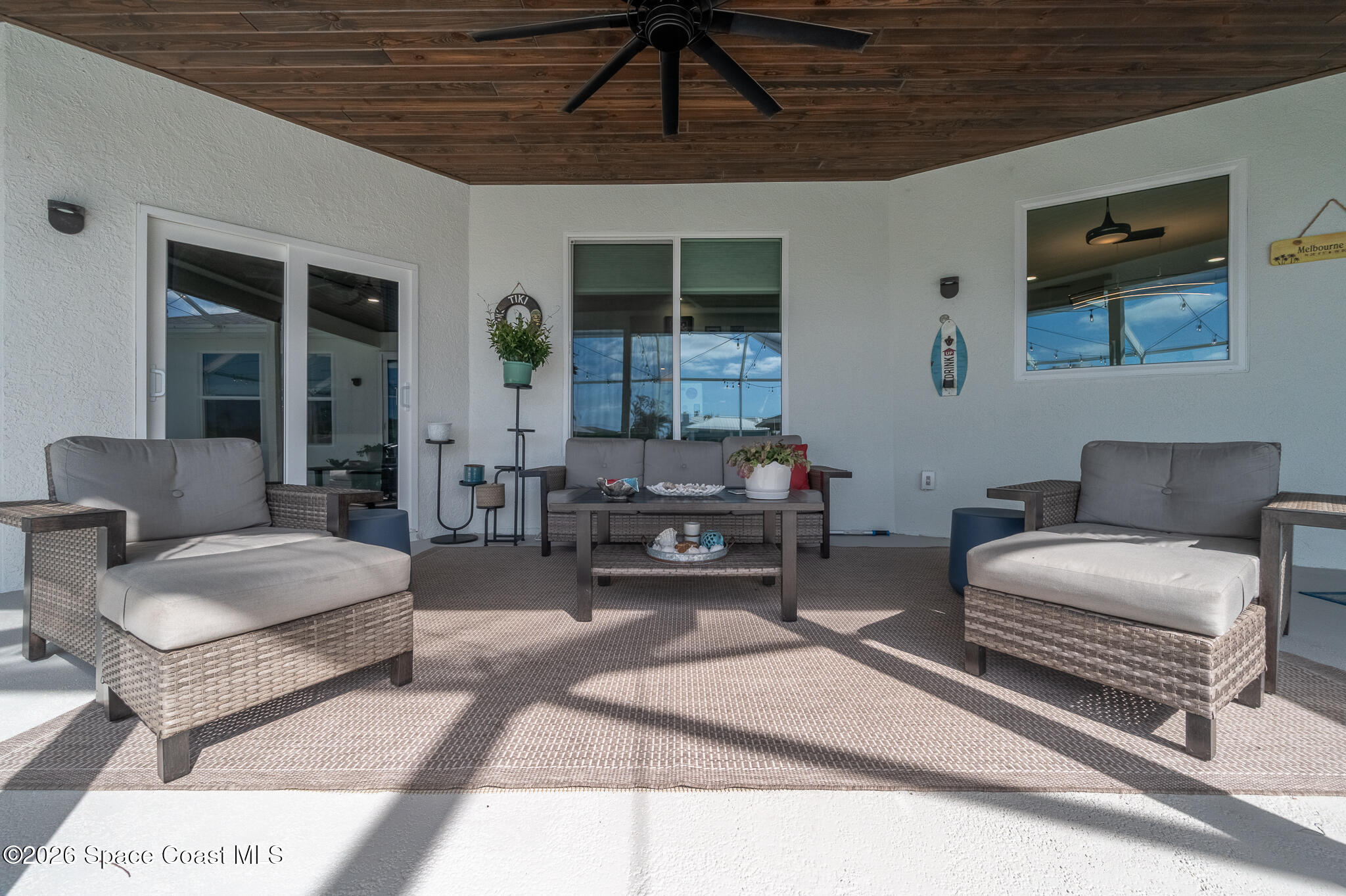 447 Sandy Key Melbourne Beach, FL 32951 - Photo 70 of 94 a living room with furniture and a potted plant