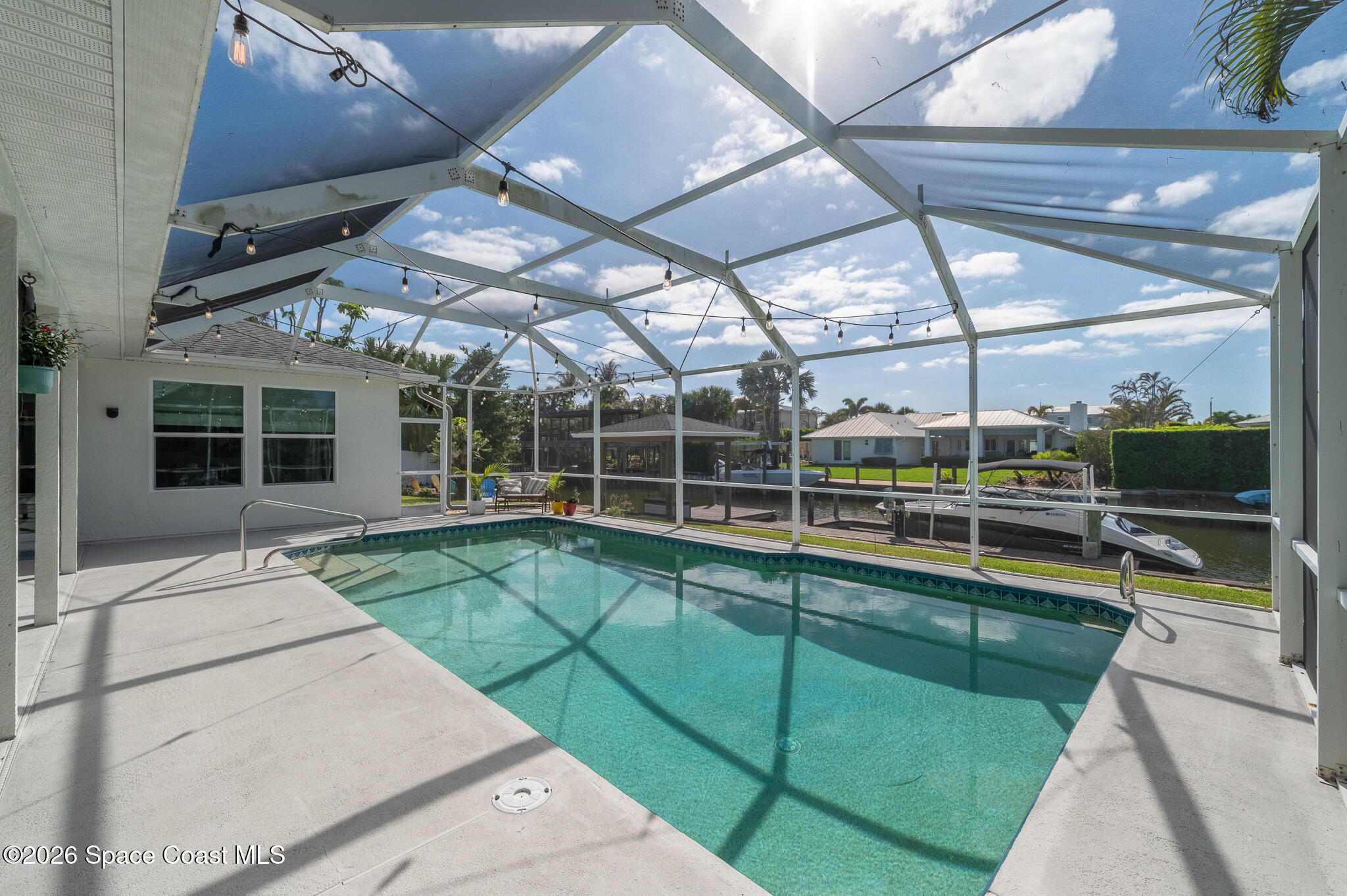 447 Sandy Key Melbourne Beach, FL 32951 - Photo 73 of 94 a view of a backyard with a swimming pool
