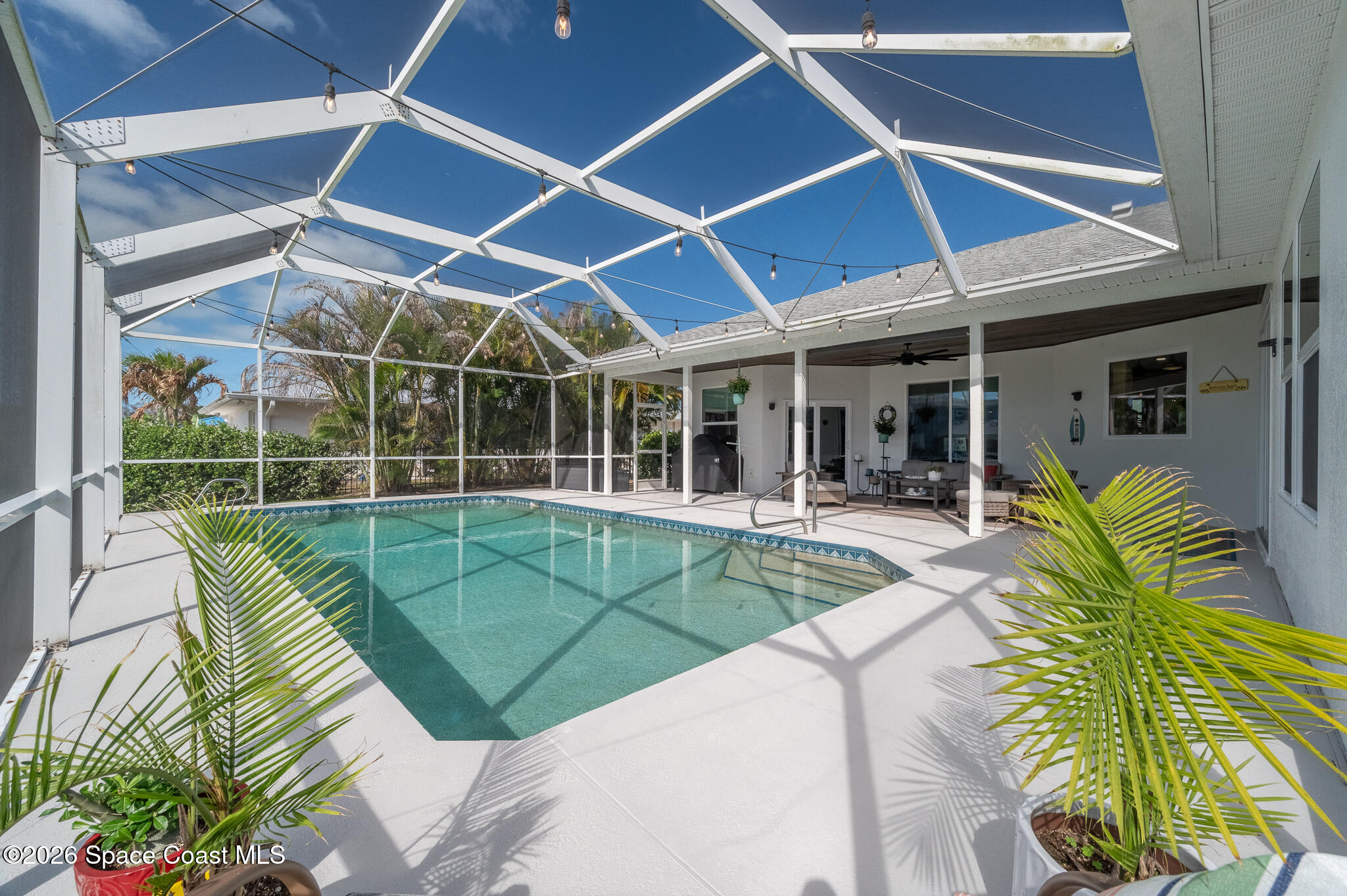 447 Sandy Key Melbourne Beach, FL 32951 - Photo 74 of 94 a view of a backyard with swimming pool and sitting area