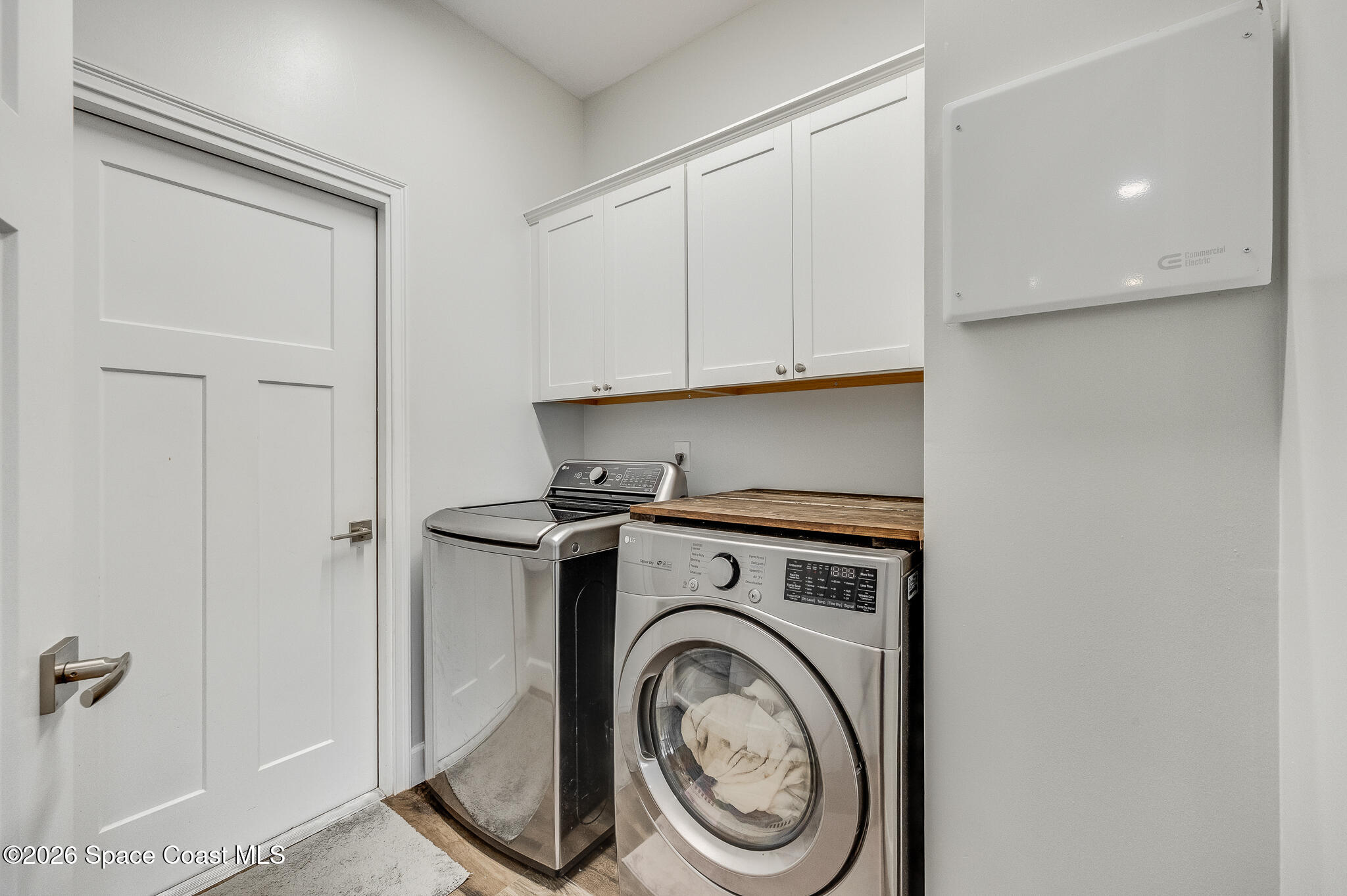 447 Sandy Key Melbourne Beach, FL 32951 - Photo 76 of 94 a utility room with dryer and washer