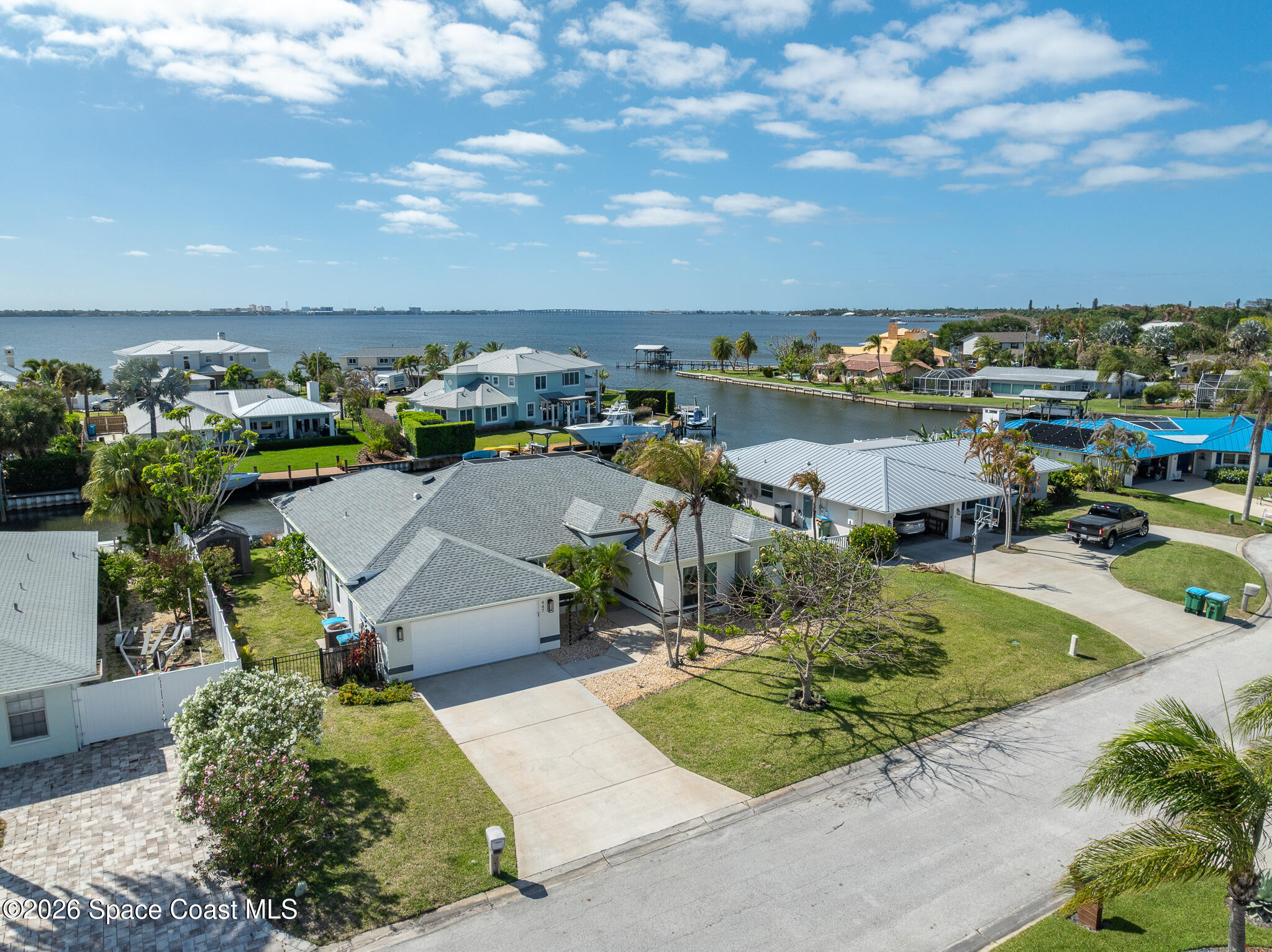 447 Sandy Key Melbourne Beach, FL 32951 - Photo 89 of 94 a view of a lake with a yard