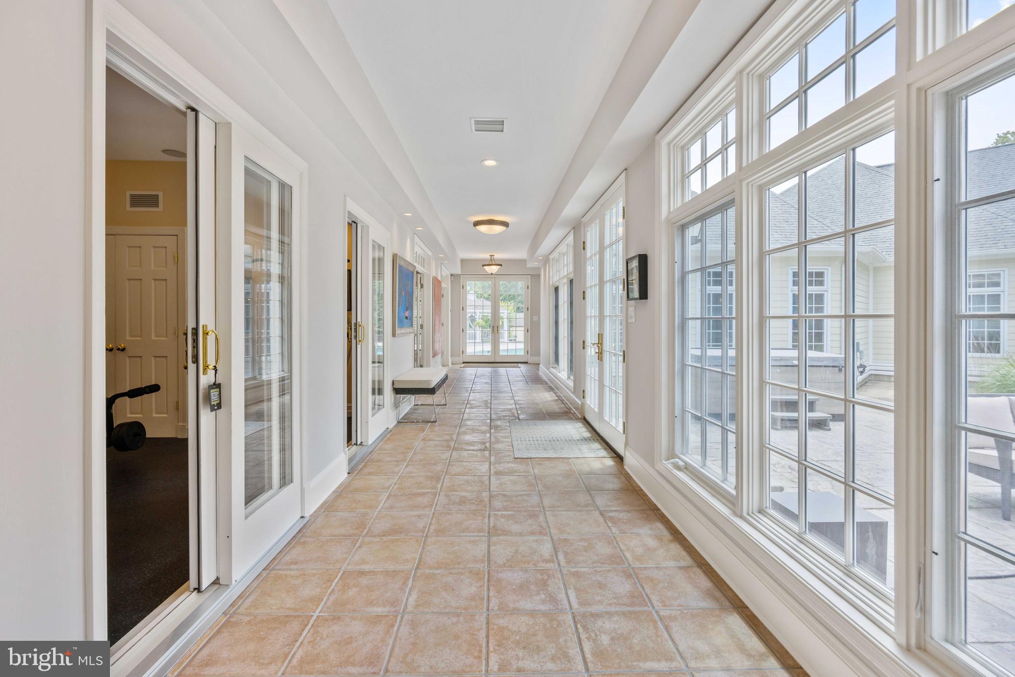 3054 Rundelac Road Annapolis, MD 21403 - Photo 21 of 38 Grand hallway to pool; lots of natural light