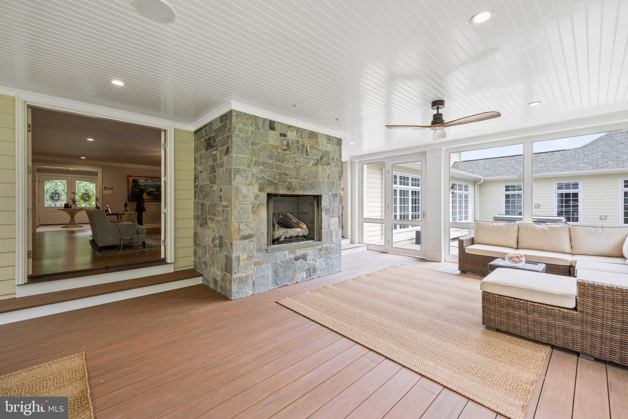 3054 Rundelac Road Annapolis, MD 21403 - Photo 9 of 38 Screened porch with fireplace
