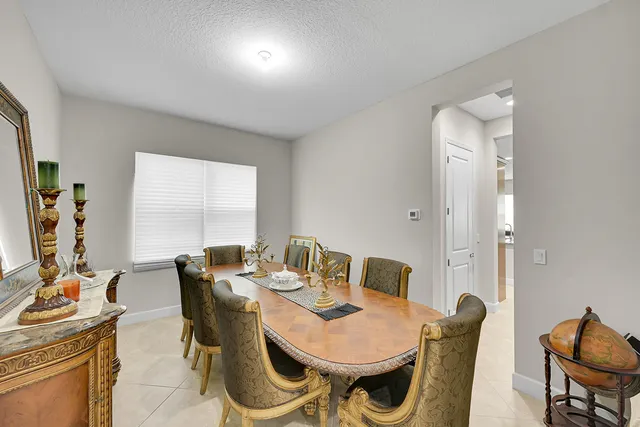 a bathroom with a granite countertop sink a toilet and a mirror