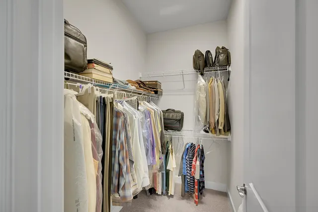 a bedroom with a bed and a mirror