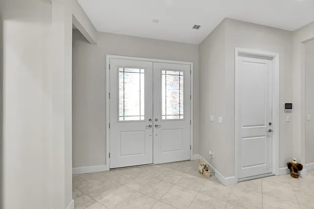 a bedroom with a bed and a table