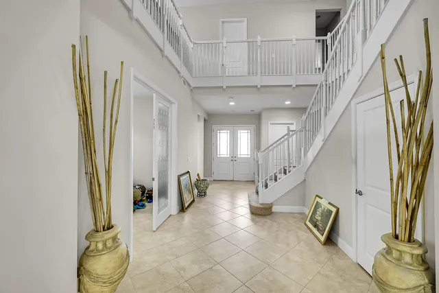 a living room with furniture a couch and a window