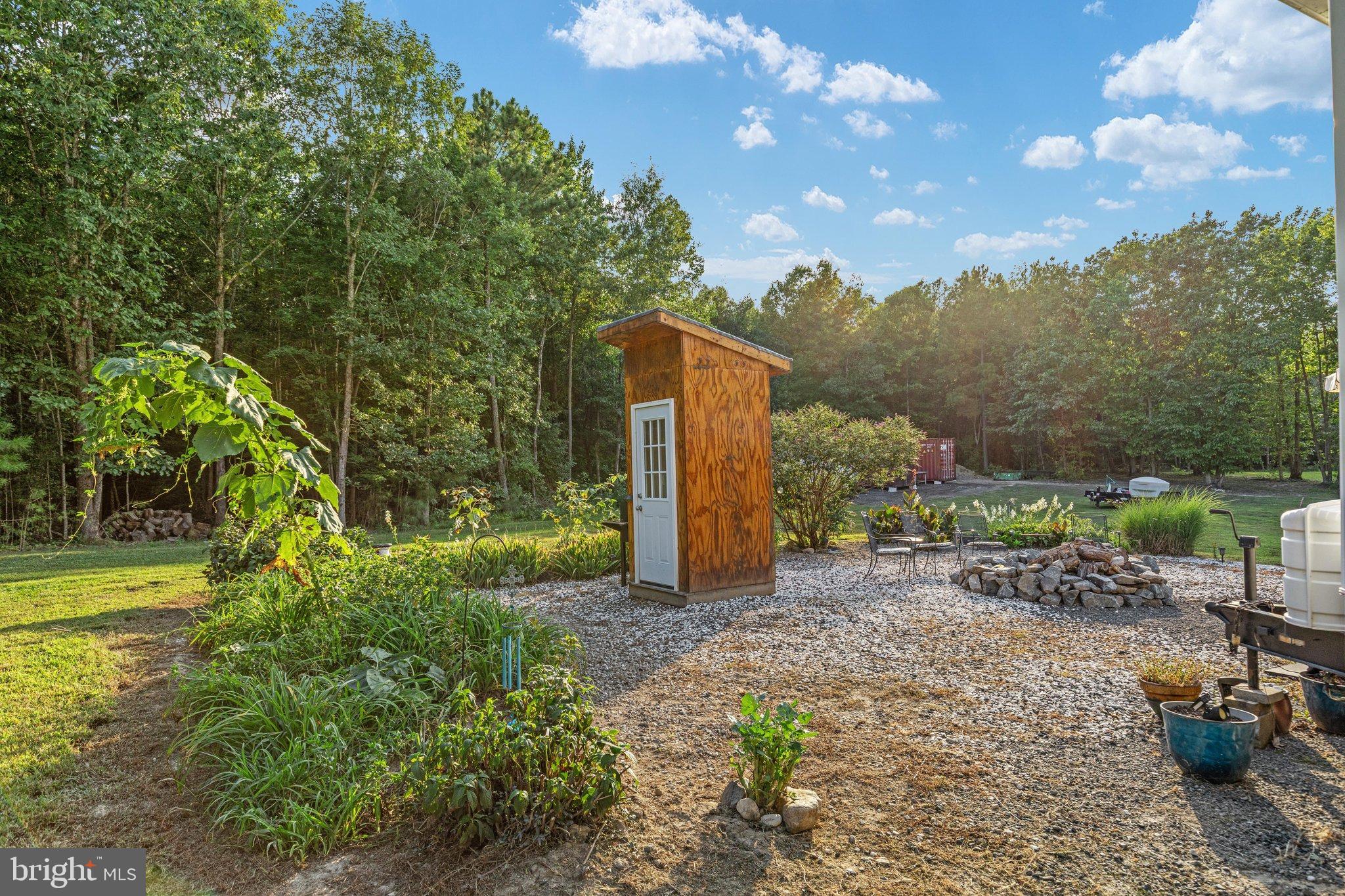 0 Flat Iron Road Montross, VA 22520 - Photo 66 of 116 Charming shed nestled in a serene garden.