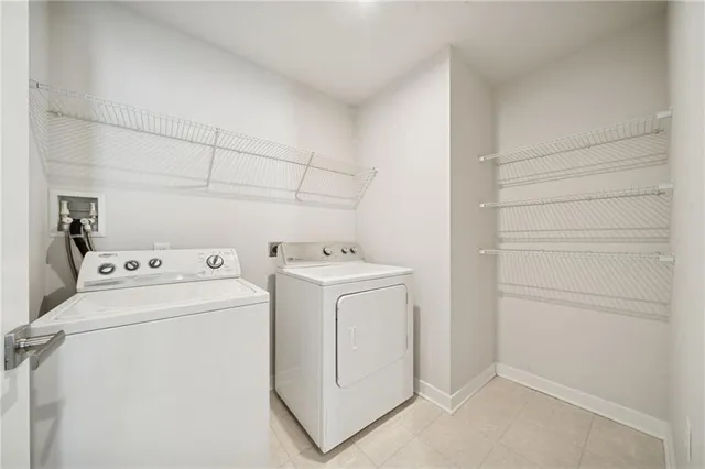 a view of storage and utility room with washer and dryer