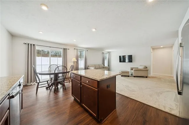 a view of a kitchen and dining room