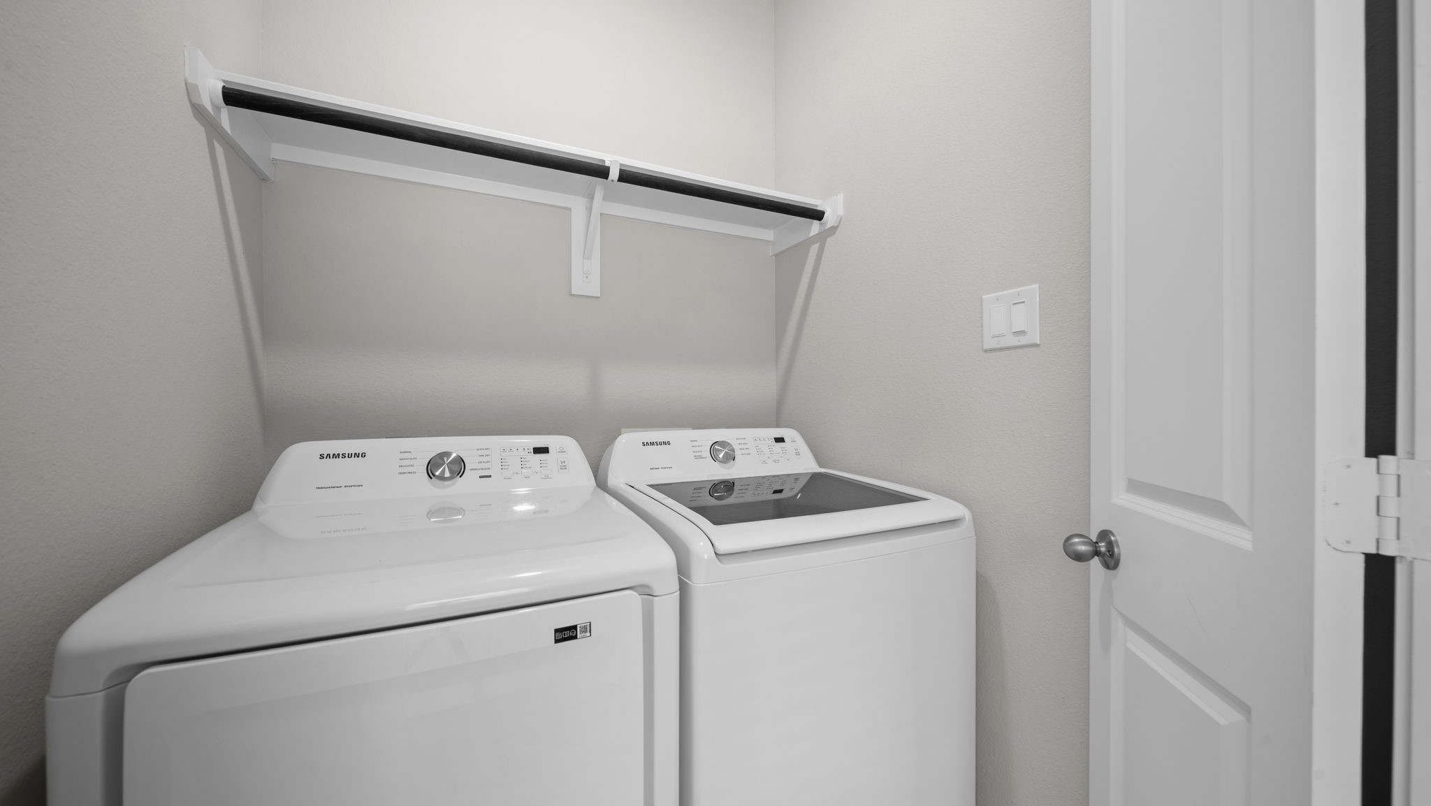 18140 Mail Rte Road Montgomery, TX 77316 - Photo 16 of 26 Convenient laundry room complete with full-size washer and dryer and overhead storage shelf.