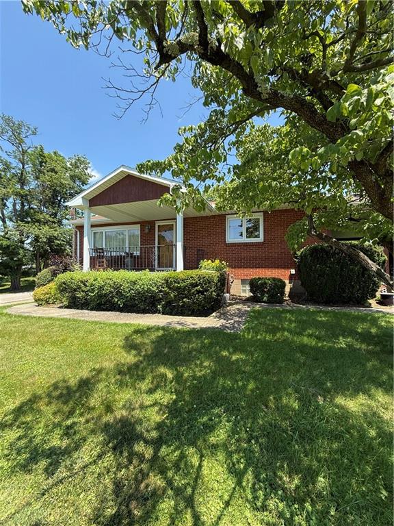 2801 7th Street Road New Kensington, PA 15068 - Photo 2 of 22 a front view of a house with a garden