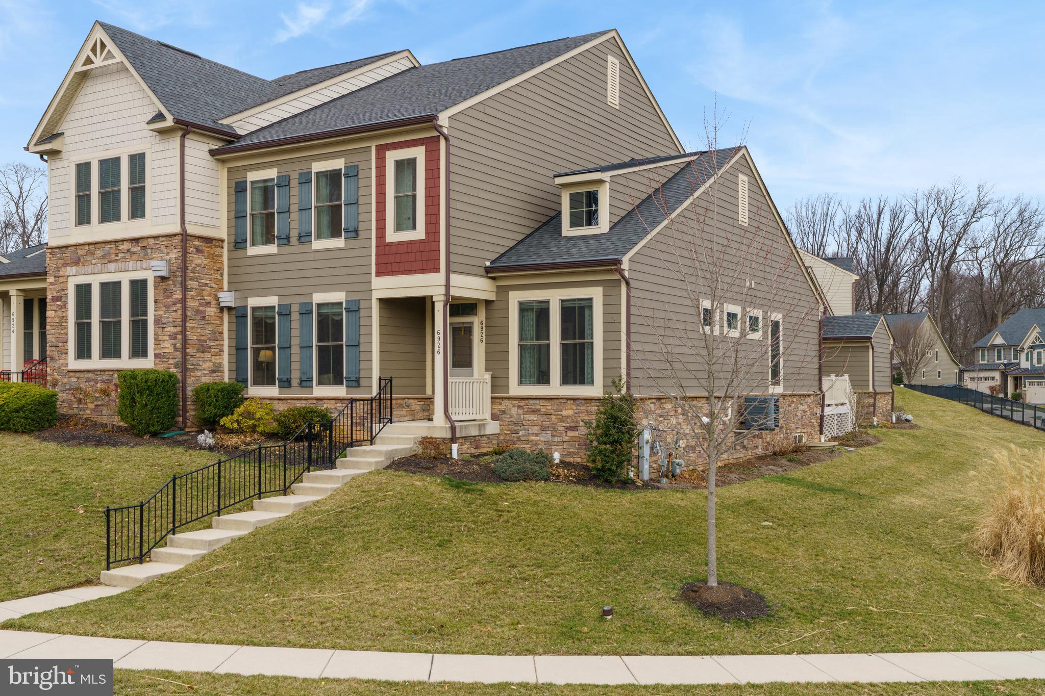 6926 Summit Circle Baltimore, MD 21239 - Photo 46 of 52 a front view of a house with garden