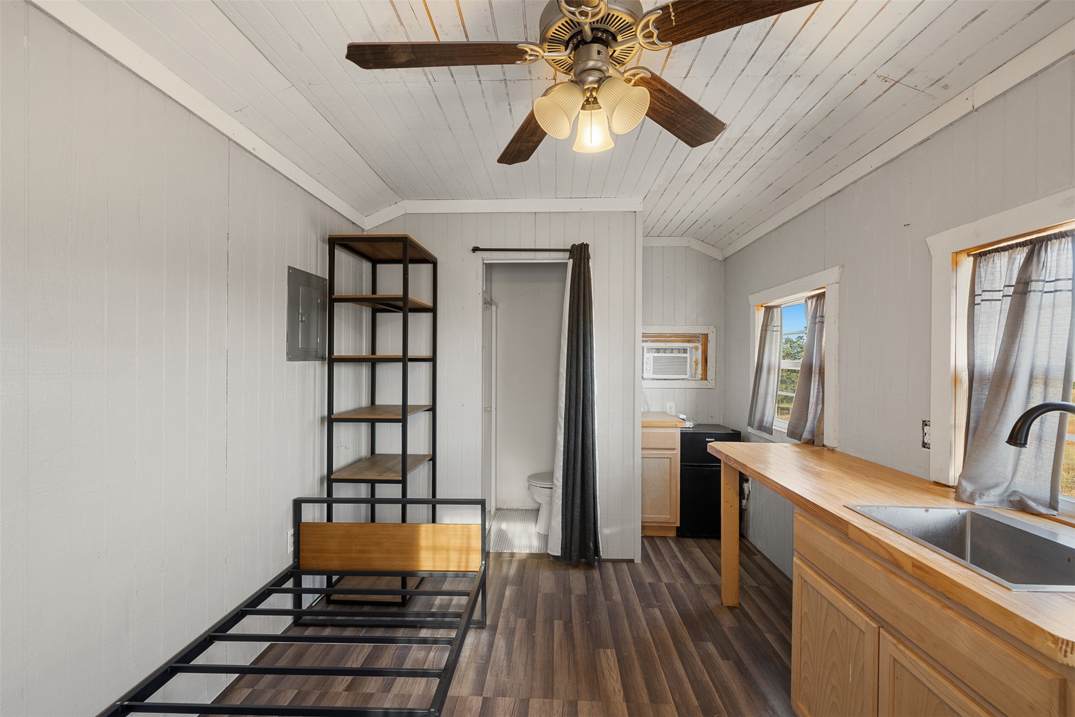 3270 Fm 671 Luling, TX 78648 - Photo 11 of 35 a kitchen with sink cabinets and wooden floor