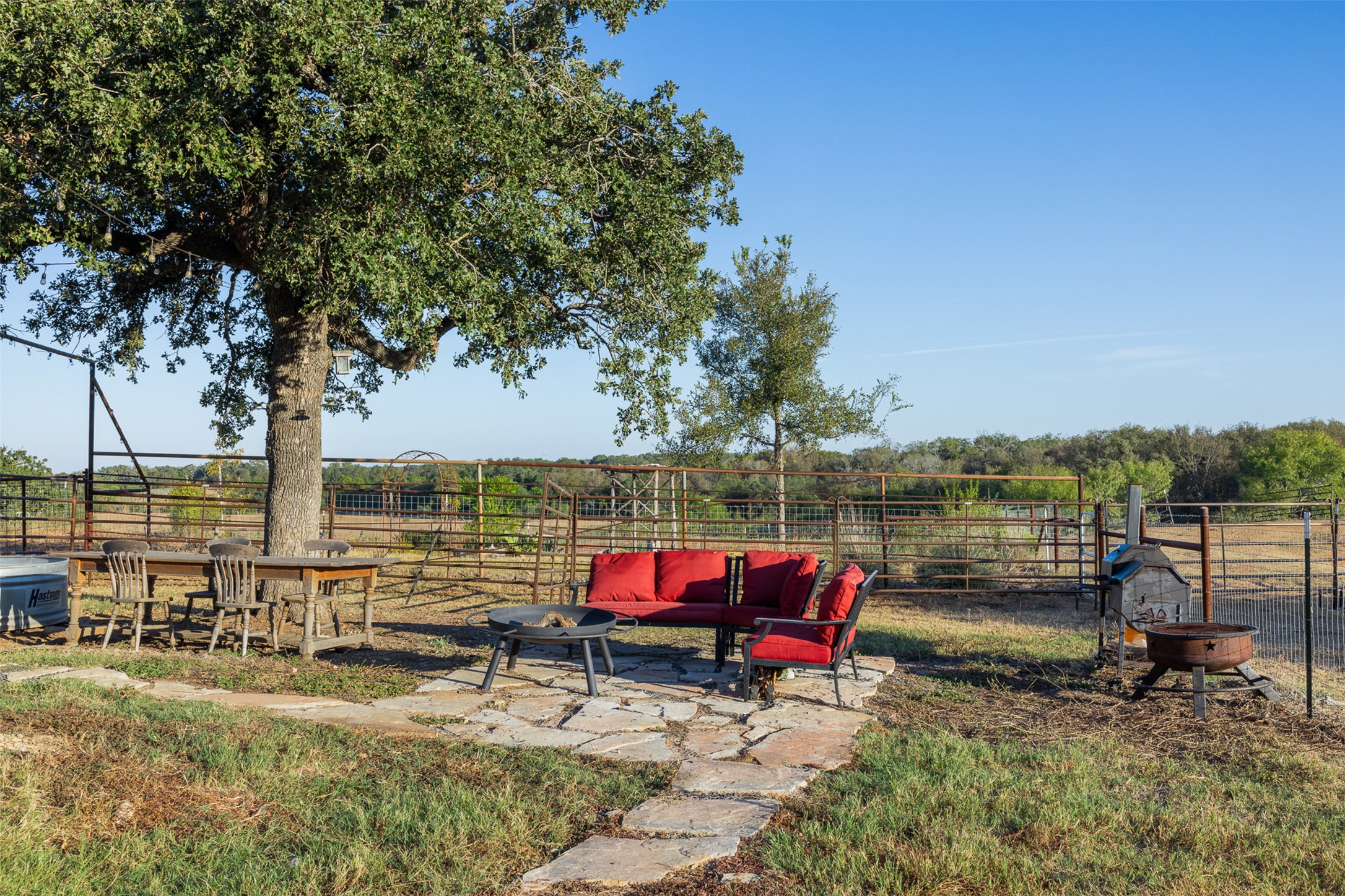 3270 Fm 671 Luling, TX 78648 - Photo 18 of 35 an outdoor sitting area with couch and wooden fence