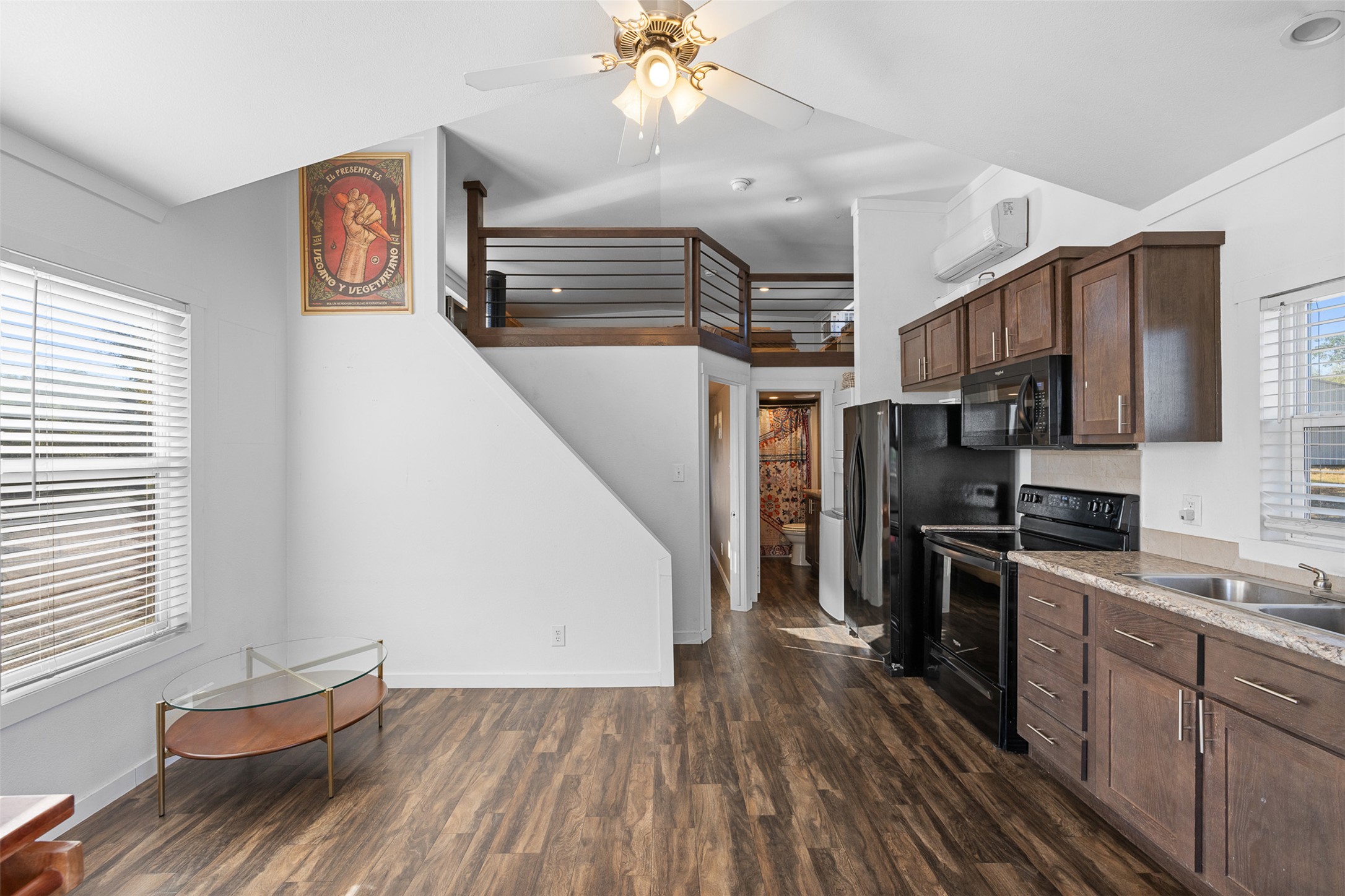 3270 Fm 671 Luling, TX 78648 - Photo 5 of 35 a kitchen with stainless steel appliances granite countertop a refrigerator a sink dishwasher a stove and white countertops with wooden floor