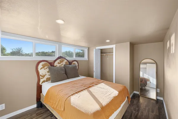 a bedroom with bed and a table