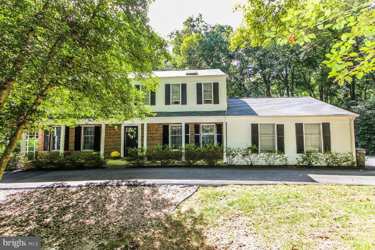2600 Penny Royal Lane Reston, VA 20191 - Photo 1 of 30 a front view of a house with a yard