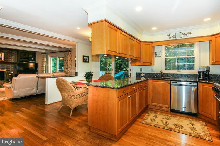 2600 Penny Royal Lane Reston, VA 20191 - Photo 15 of 30 a kitchen with stainless steel appliances granite countertop a stove a sink and a refrigerator