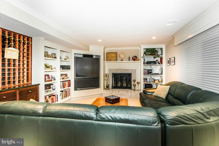 2600 Penny Royal Lane Reston, VA 20191 - Photo 25 of 30 a living room with furniture and a fireplace
