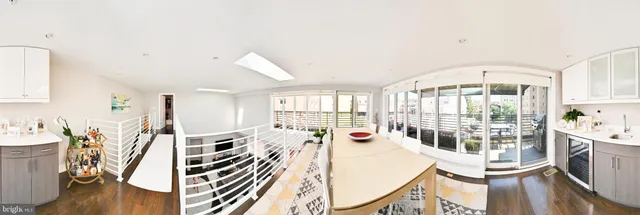 a view of a living room and dining room