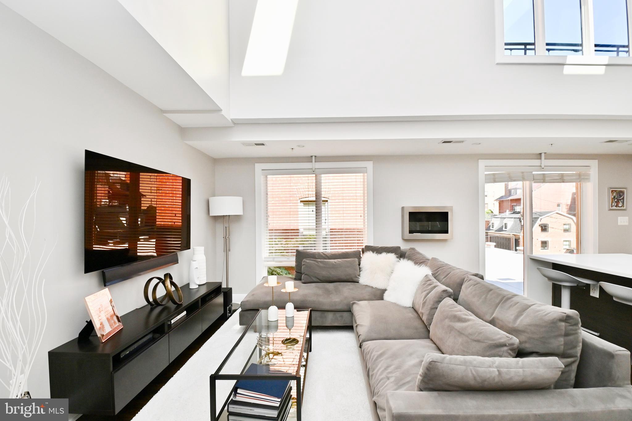 2012 Kalorama Road Northwest, Unit 8 Washington, DC 20009 - Photo 22 of 45 a living room with furniture and a flat screen tv