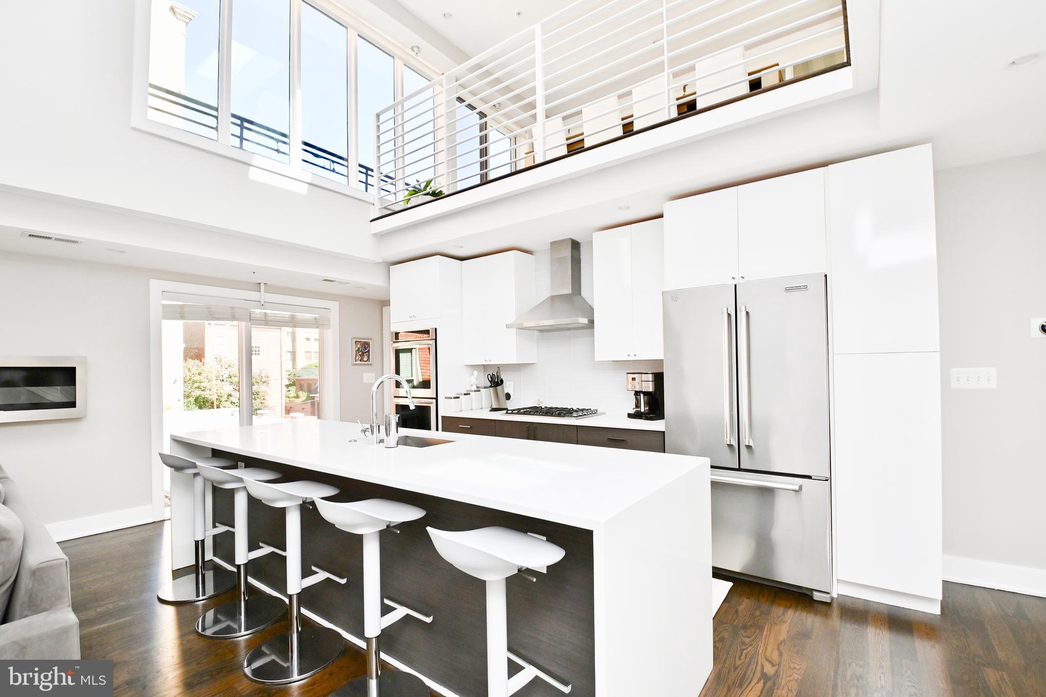 2012 Kalorama Road Northwest, Unit 8 Washington, DC 20009 - Photo 23 of 45 a kitchen with stainless steel appliances a sink and a refrigerator