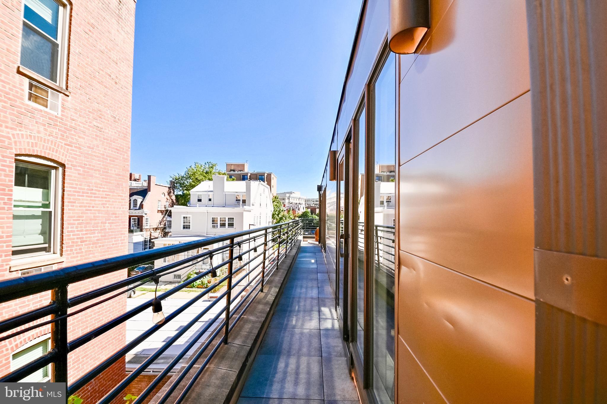 2012 Kalorama Road Northwest, Unit 8 Washington, DC 20009 - Photo 29 of 45 a view of a balcony with wooden floor
