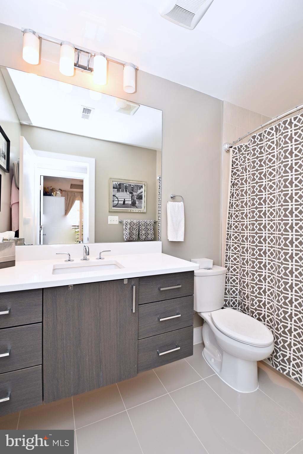 2012 Kalorama Road Northwest, Unit 8 Washington, DC 20009 - Photo 31 of 45 a bathroom with a toilet a sink and a mirror