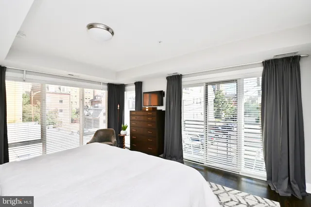 a bedroom with a bed and a television