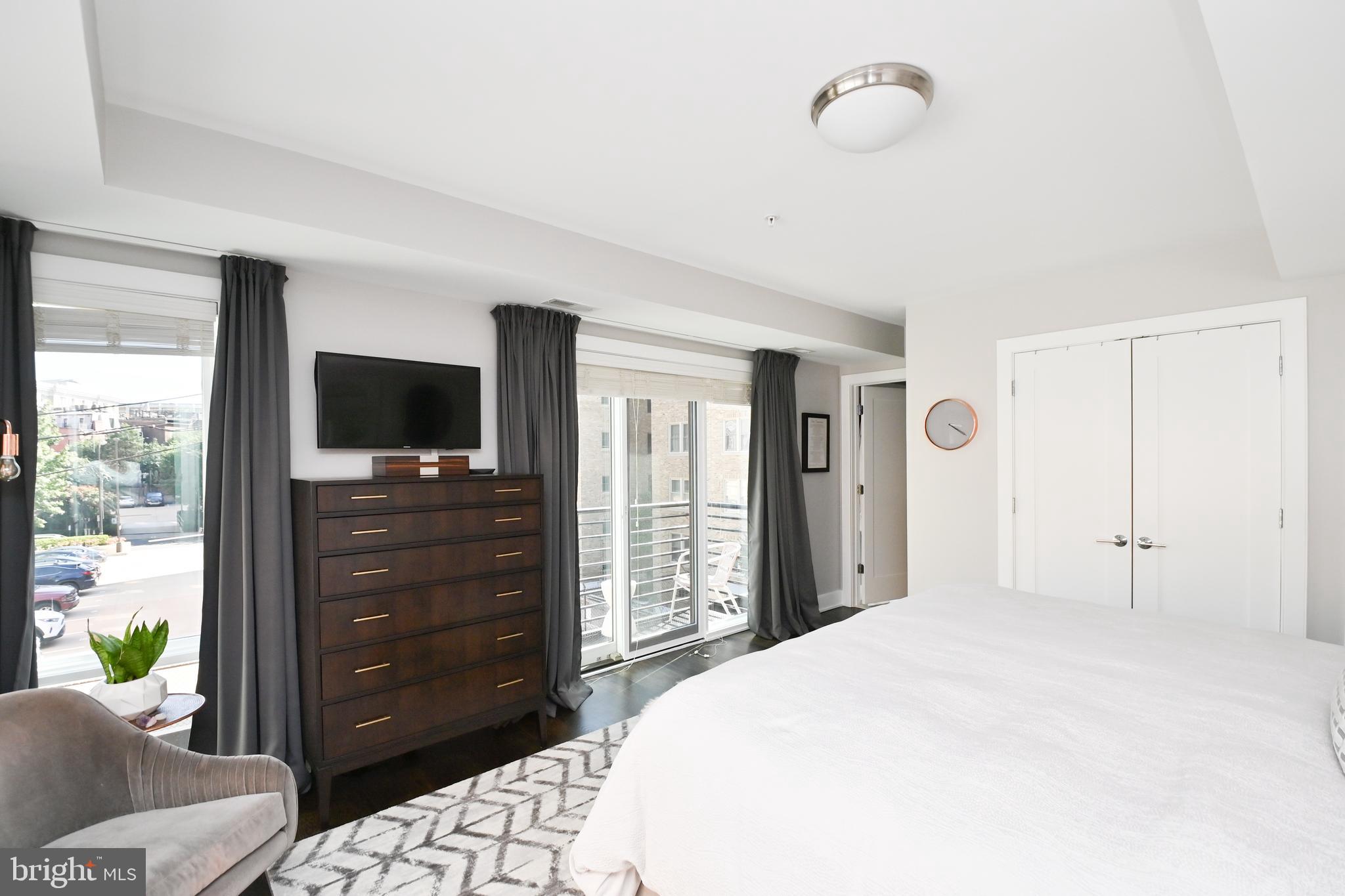 2012 Kalorama Road Northwest, Unit 8 Washington, DC 20009 - Photo 38 of 45 a bedroom with a bed and a television