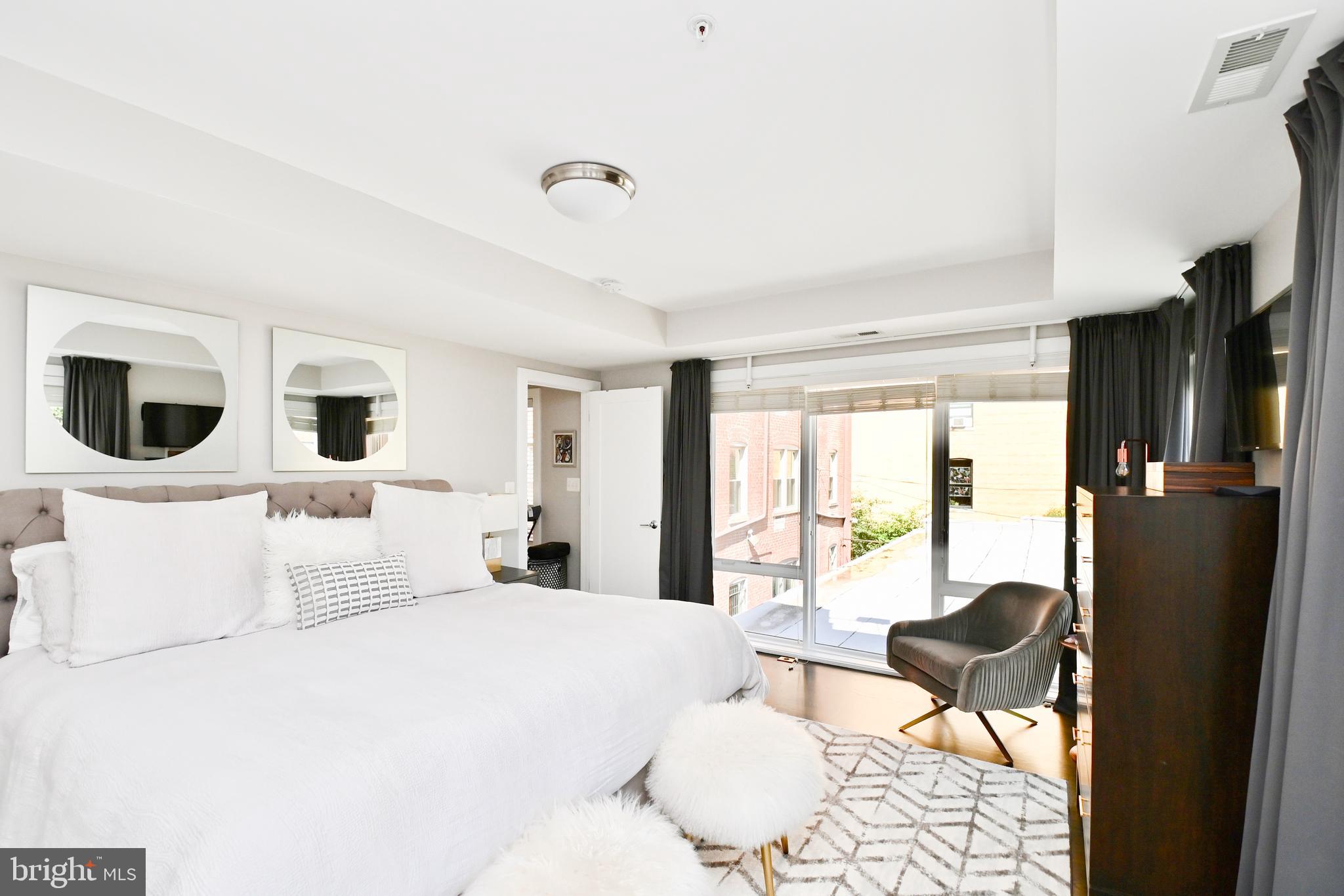 2012 Kalorama Road Northwest, Unit 8 Washington, DC 20009 - Photo 39 of 45 a bedroom with a bed and wooden floor