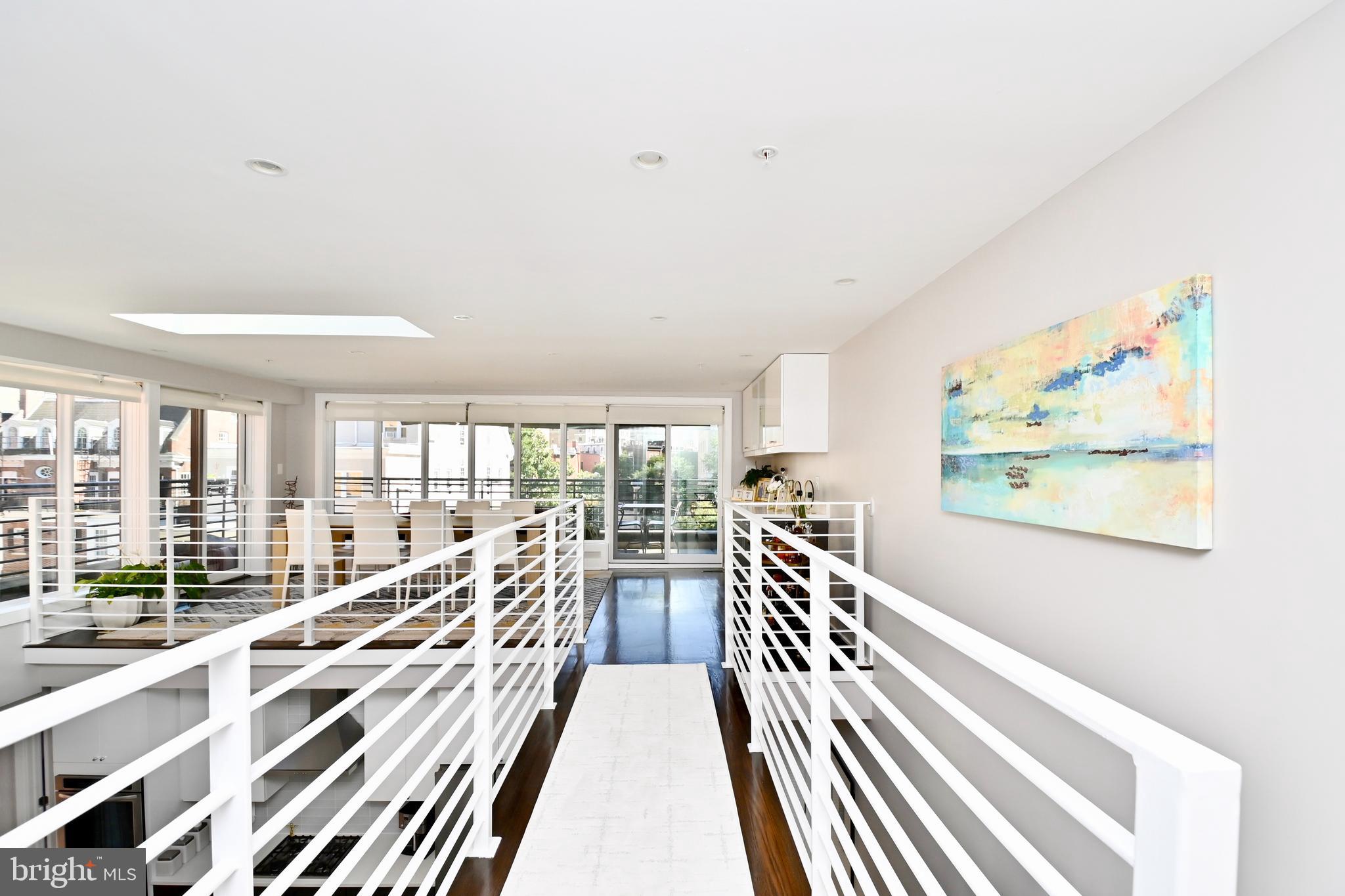 2012 Kalorama Road Northwest, Unit 8 Washington, DC 20009 - Photo 5 of 45 a view of a large room with wooden floor and windows