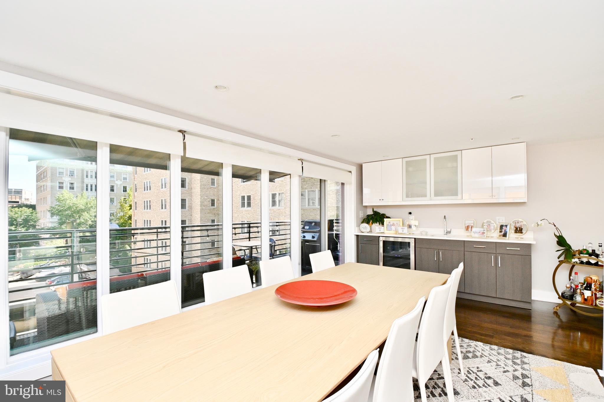 2012 Kalorama Road Northwest, Unit 8 Washington, DC 20009 - Photo 10 of 45 a kitchen with stainless steel appliances kitchen island granite countertop a table and chairs in it