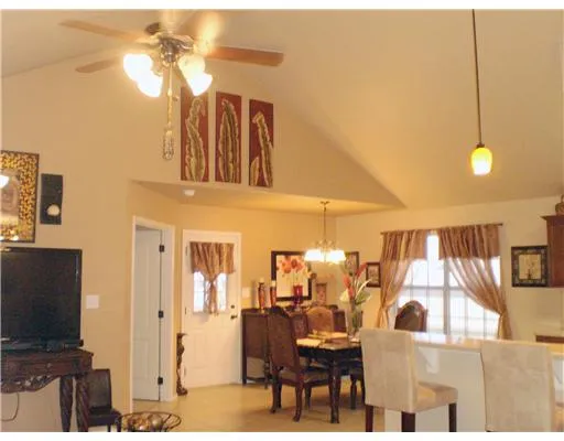a view of a livingroom with furniture and a flat screen tv