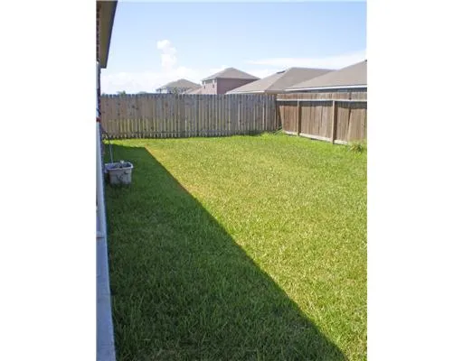 a view of a back yard of the house