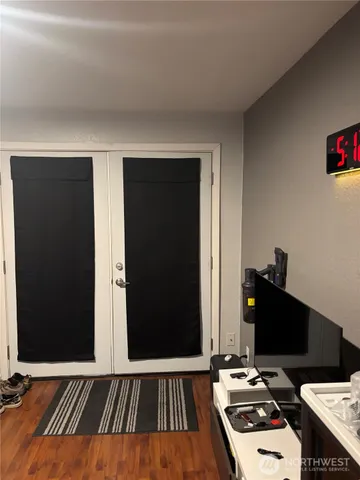 a bedroom with a bed and a desk