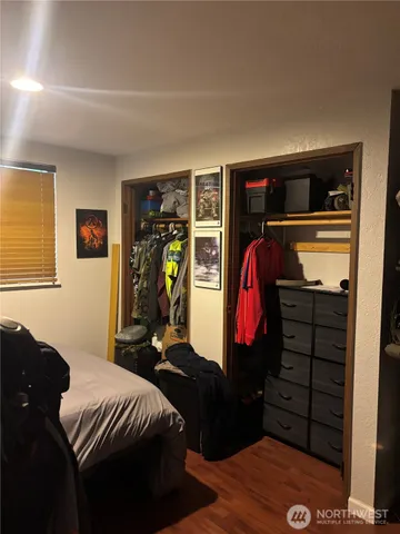 a living room with furniture a air conditioner vent and a window