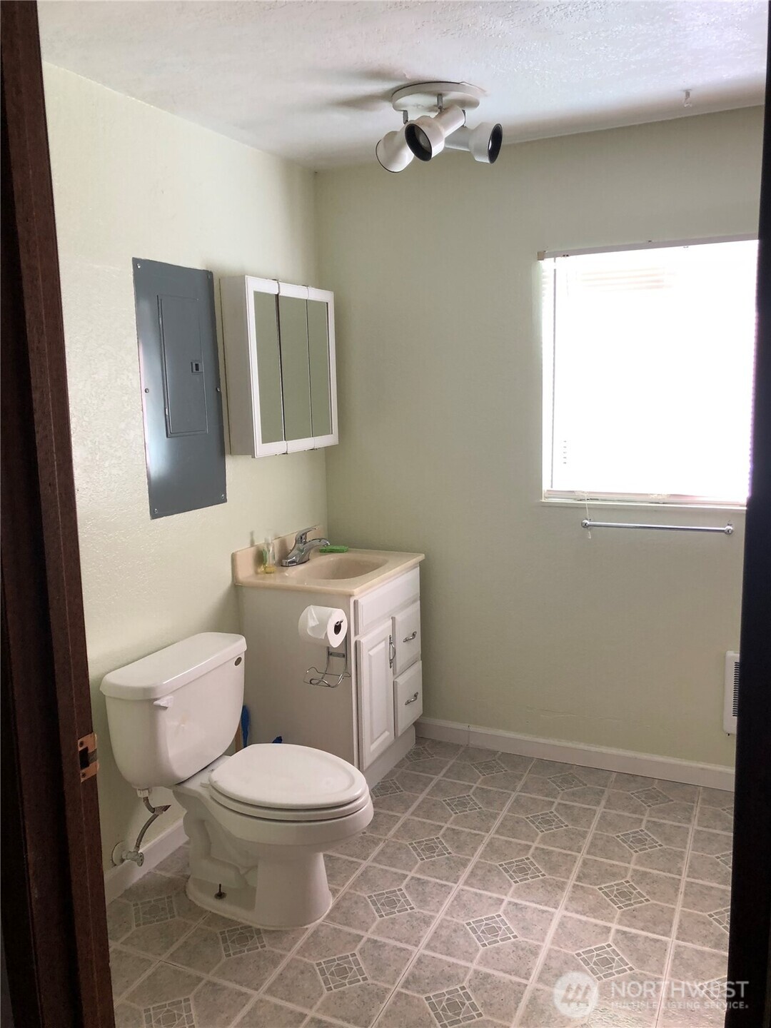 22010 Brier Road Brier, WA 98036 - Photo 27 of 34 a bathroom with a toilet a sink and mirror
