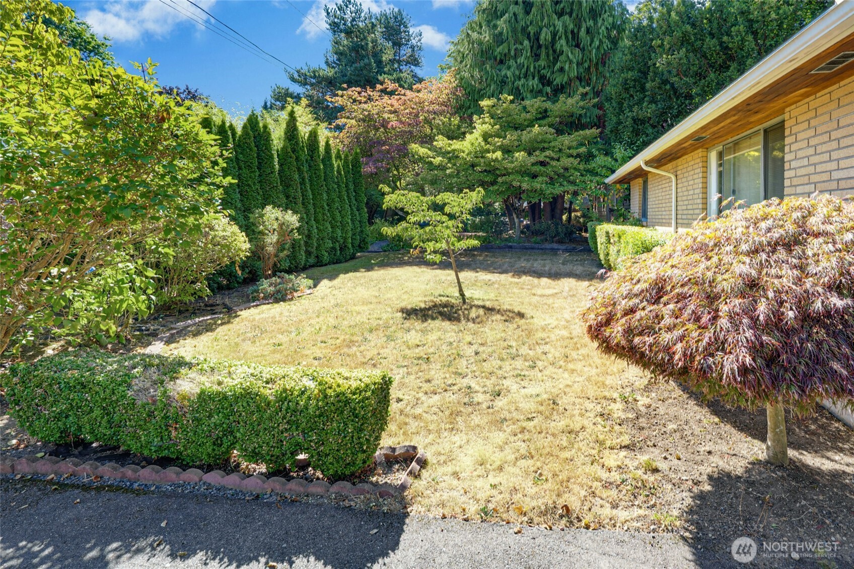 22010 Brier Road Brier, WA 98036 - Photo 29 of 34 a backyard of a house with a yard and outdoor seating