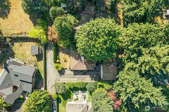 an aerial view of a house with a yard