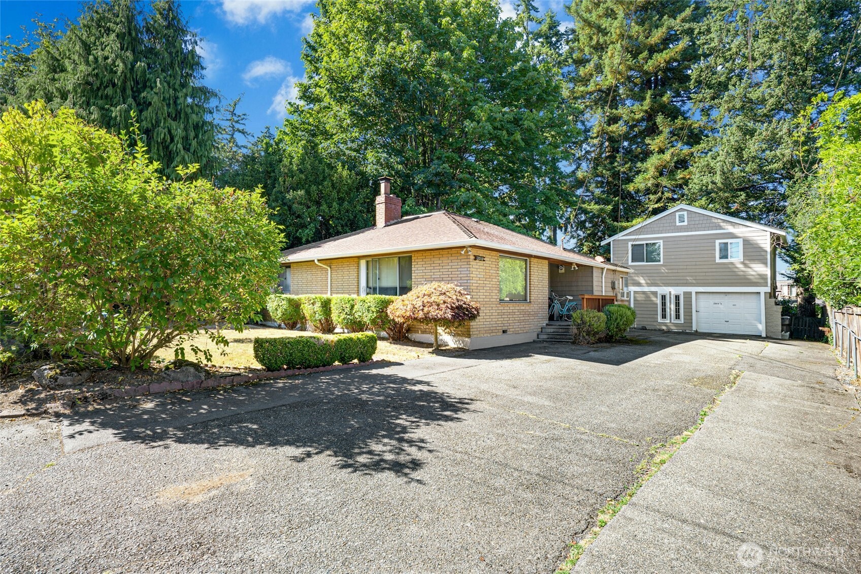 22010 Brier Road Brier, WA 98036 - Photo 5 of 34 a front view of a house with a yard and garage