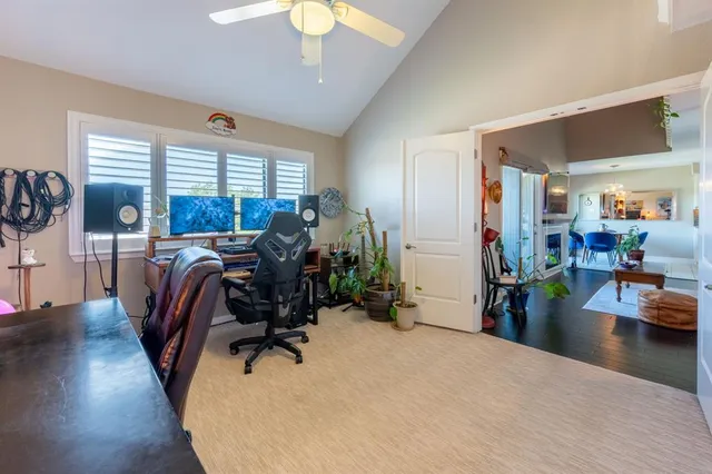 a view of a livingroom with furniture and a window