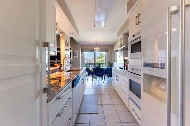 a kitchen with granite countertop lots of counter top space