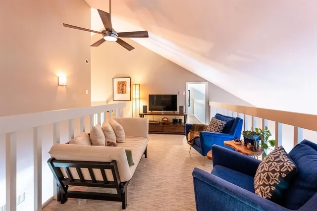 a living room with furniture fireplace and a flat screen tv