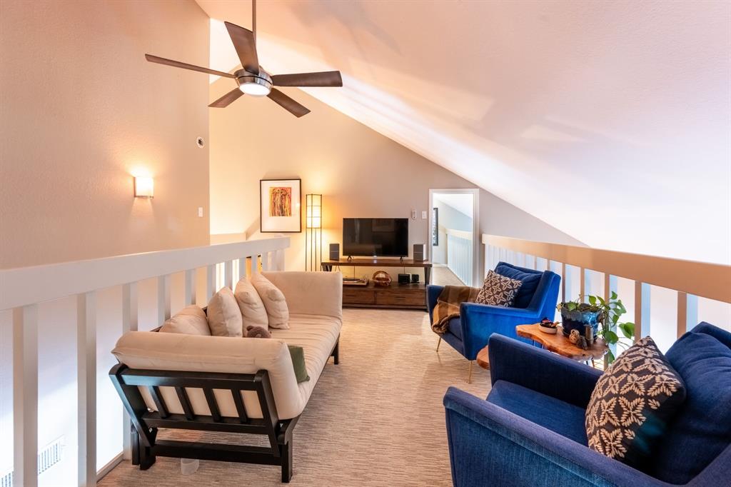 812 Signal Ridge Place Rockwall, TX 75032 - Photo 23 of 29 a living room with furniture fireplace and a flat screen tv