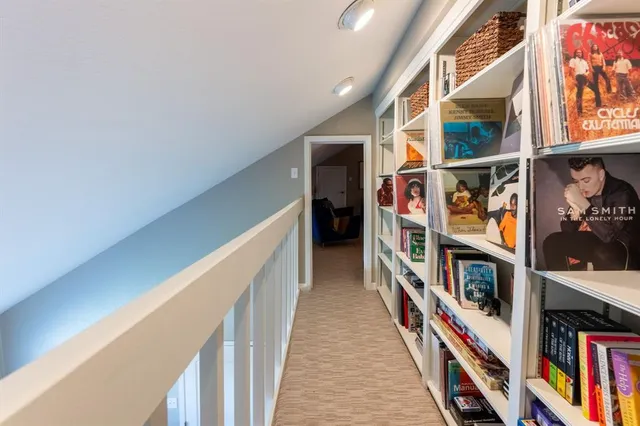 a view of a hallway with wooden floor and entryway