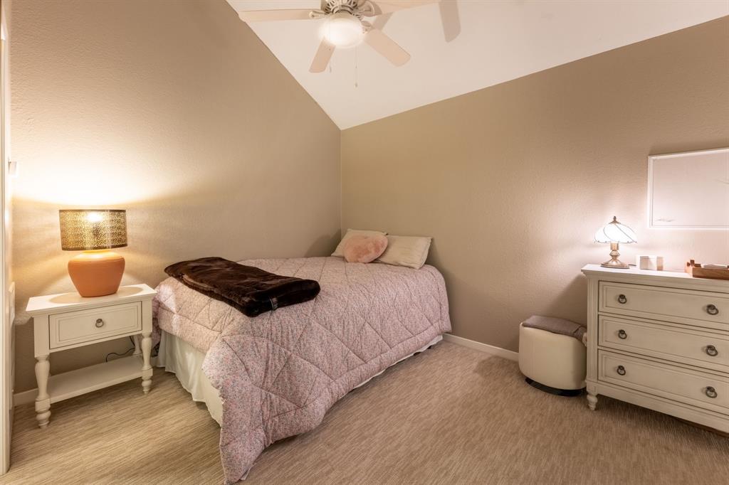 812 Signal Ridge Place Rockwall, TX 75032 - Photo 26 of 29 a bedroom with a bed and a cabinets