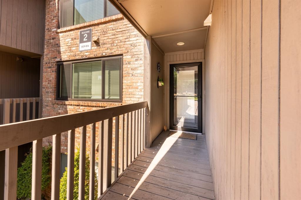 812 Signal Ridge Place Rockwall, TX 75032 - Photo 5 of 29 a view of a porch with wooden floor and stairs